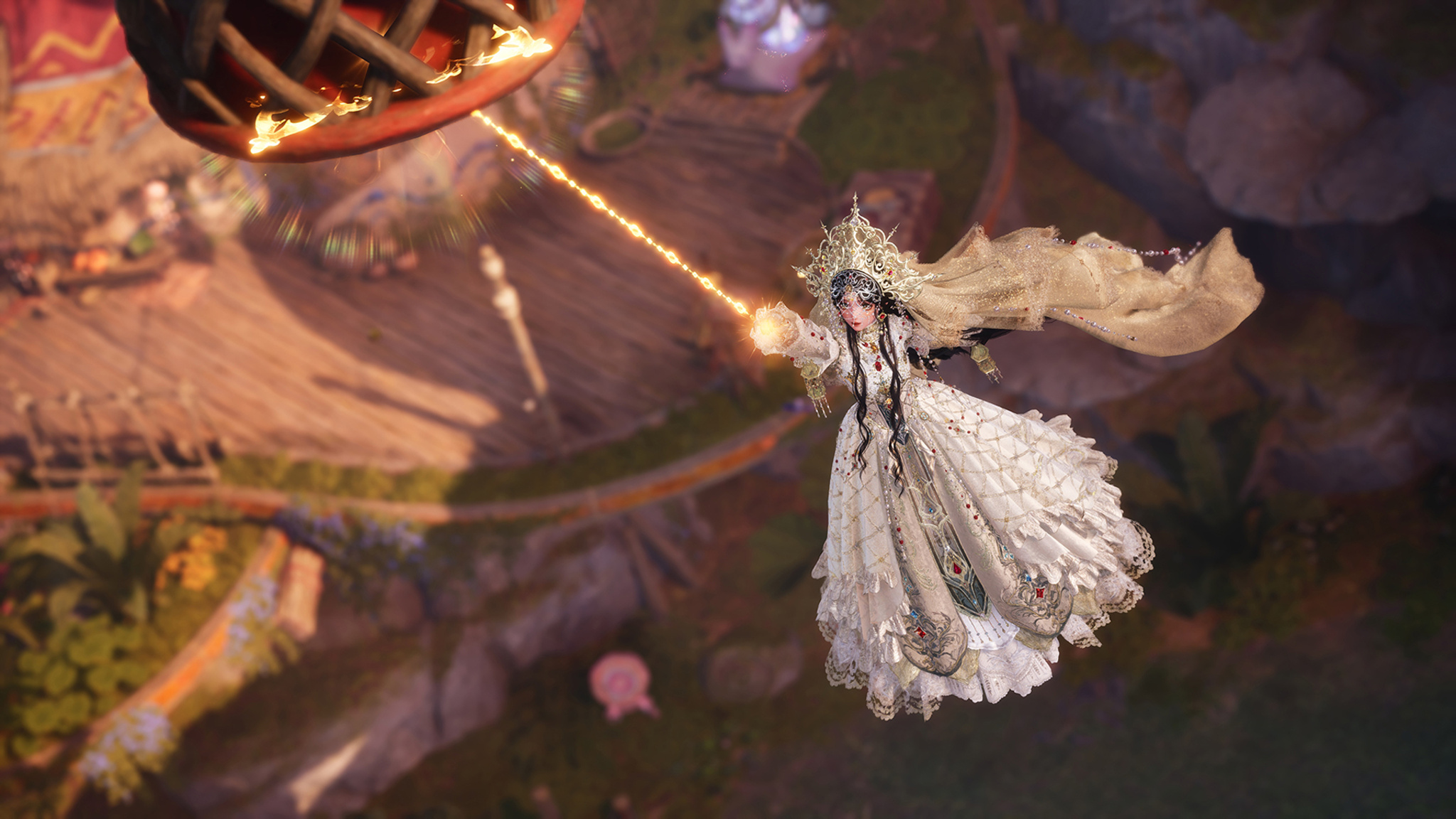 A fantasy game character dressed in an elaborate white lace gown and ornate gold crown floats in midair, shooting a beam of golden light from her hand toward a large mechanical wheel. A whimsical village is visible far below.