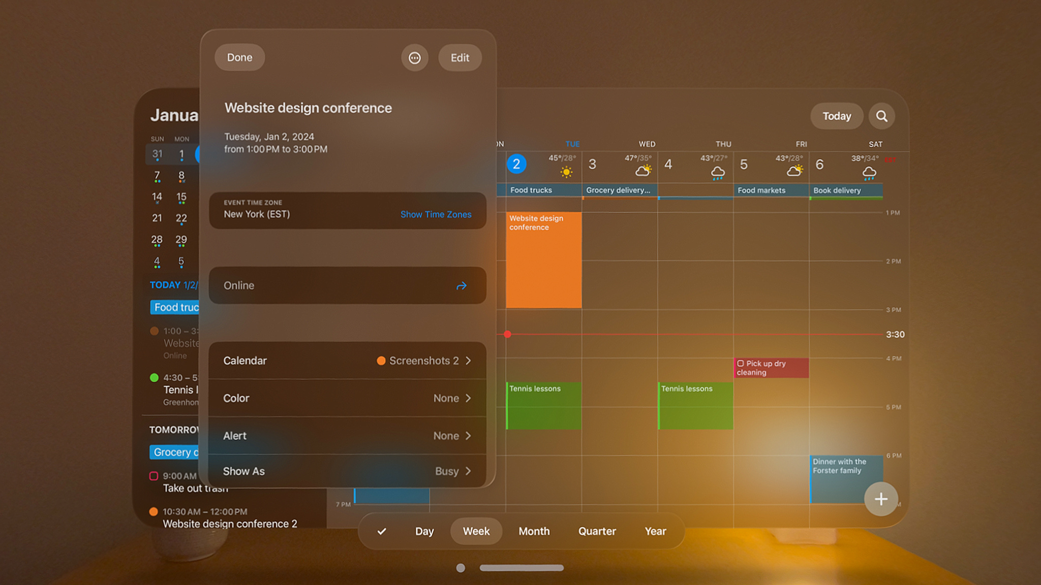 A monthly calendar is displayed in a low-lit room on Fantastical.