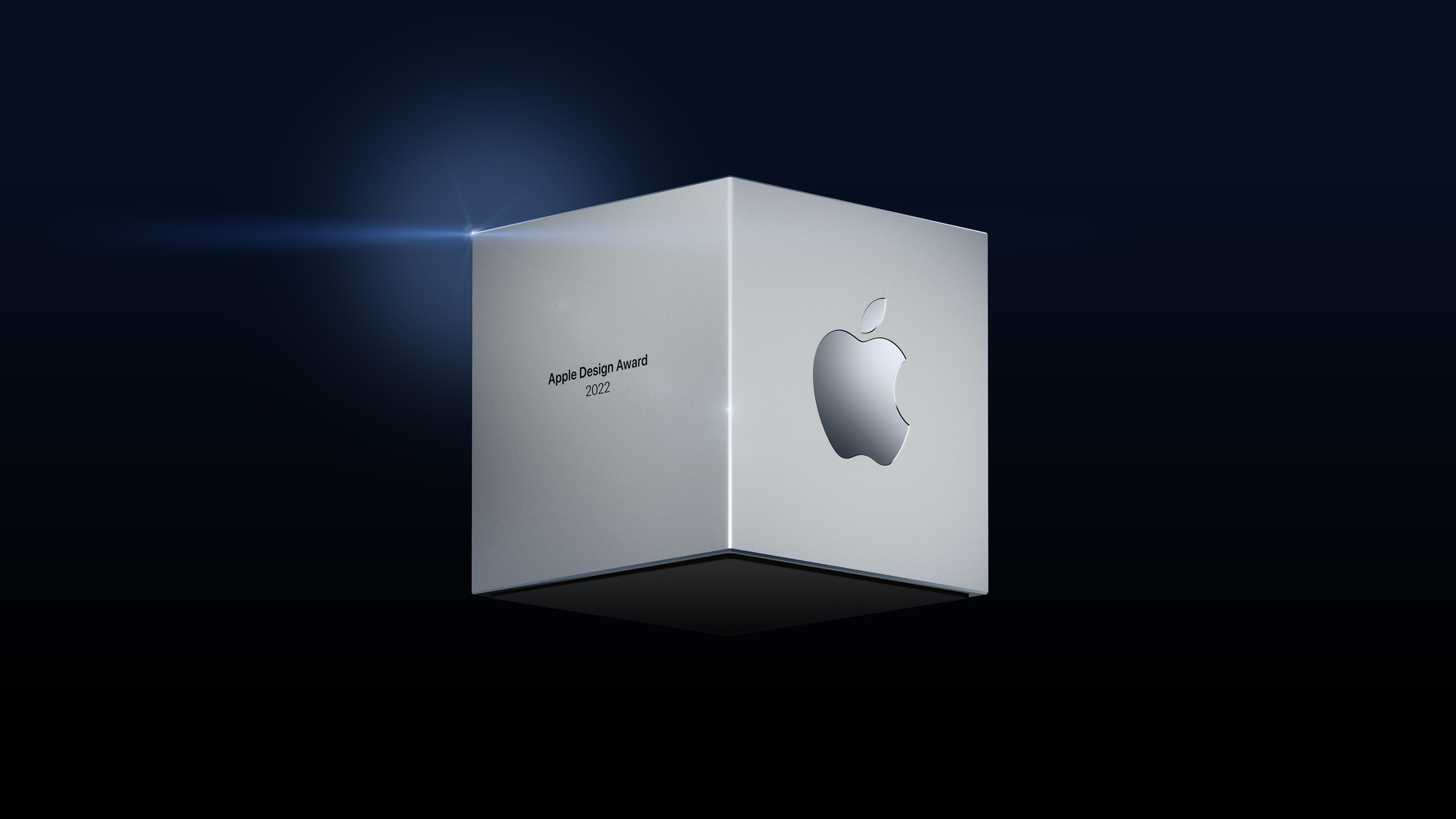 Apple Design Award cube on dark background