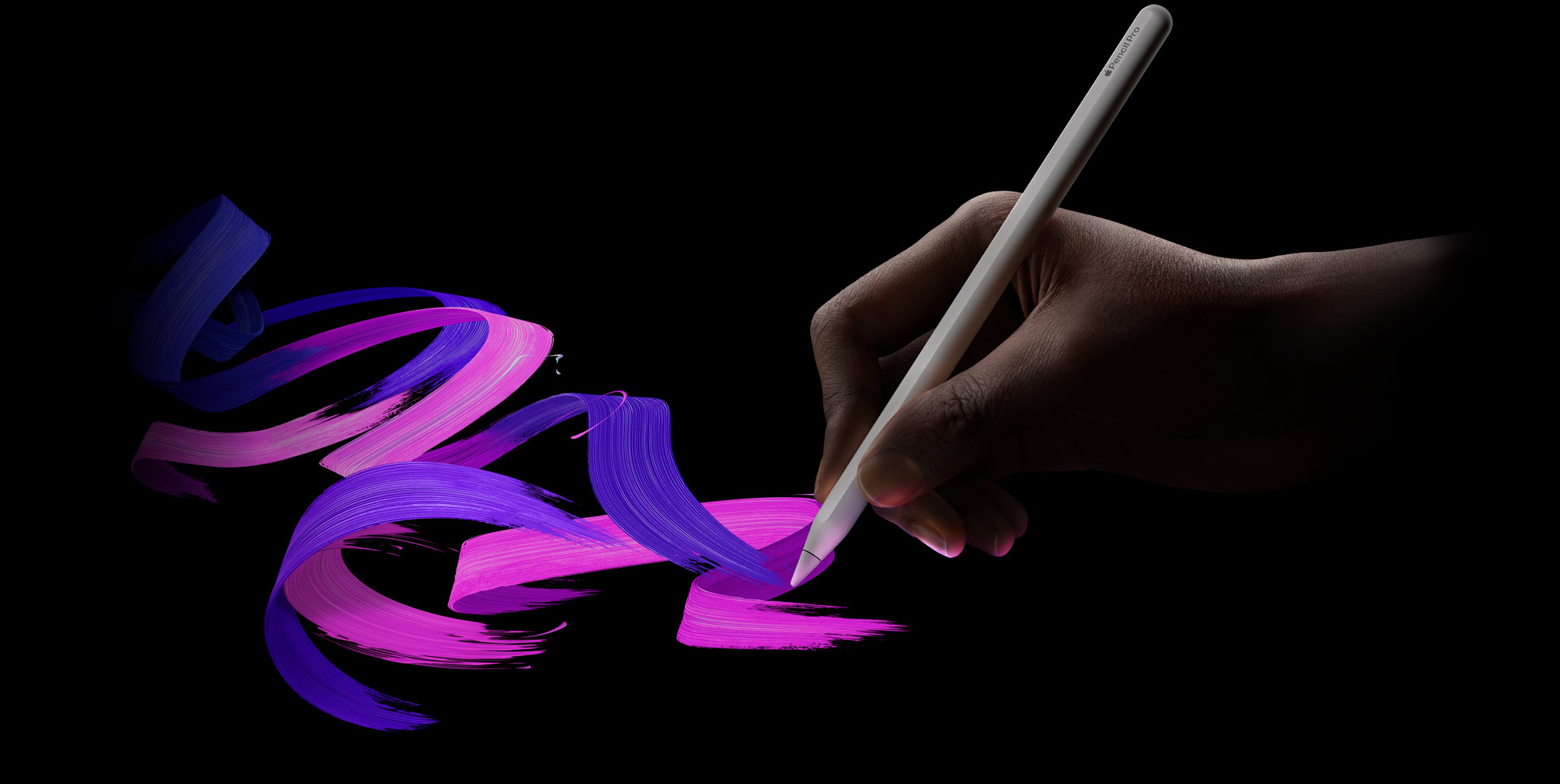 An example of a hand drawing with the Apple Pencil Pro, creating a series of pink and purple swirls.