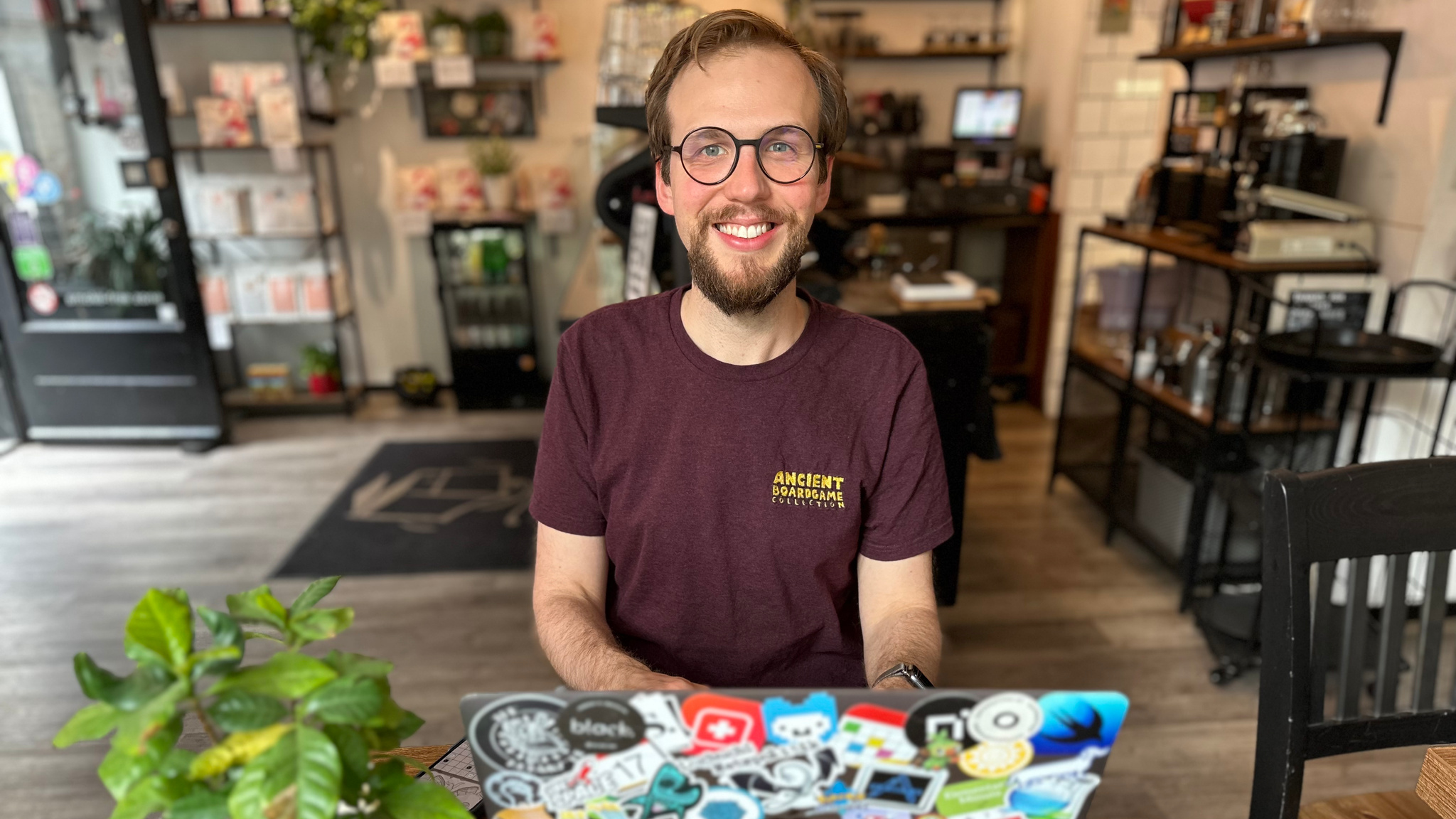 A photo of developer Klemens Strasser seated at his desk.