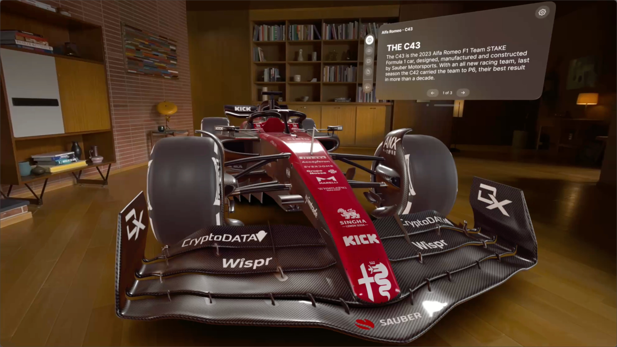 An Apple Vision Pro screenshot of a dark cherry red Alfa Romeo Formula 1 car in a living room. 