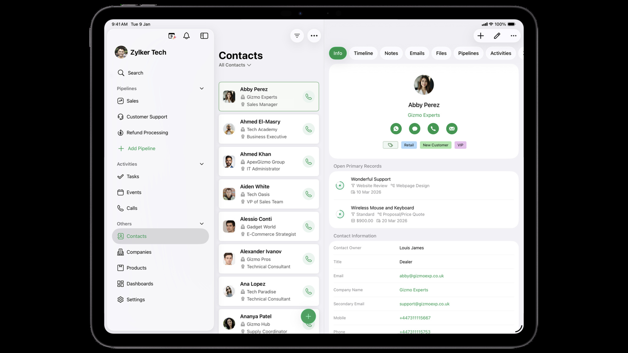 An iPad screen displaying the Bigin CRM app interface, showing a three-pane layout. The left sidebar lists navigation options under Zylker Tech, the middle column displays a list of contacts, and the right pane shows detailed contact information for Abby Perez of Gizmo Experts.