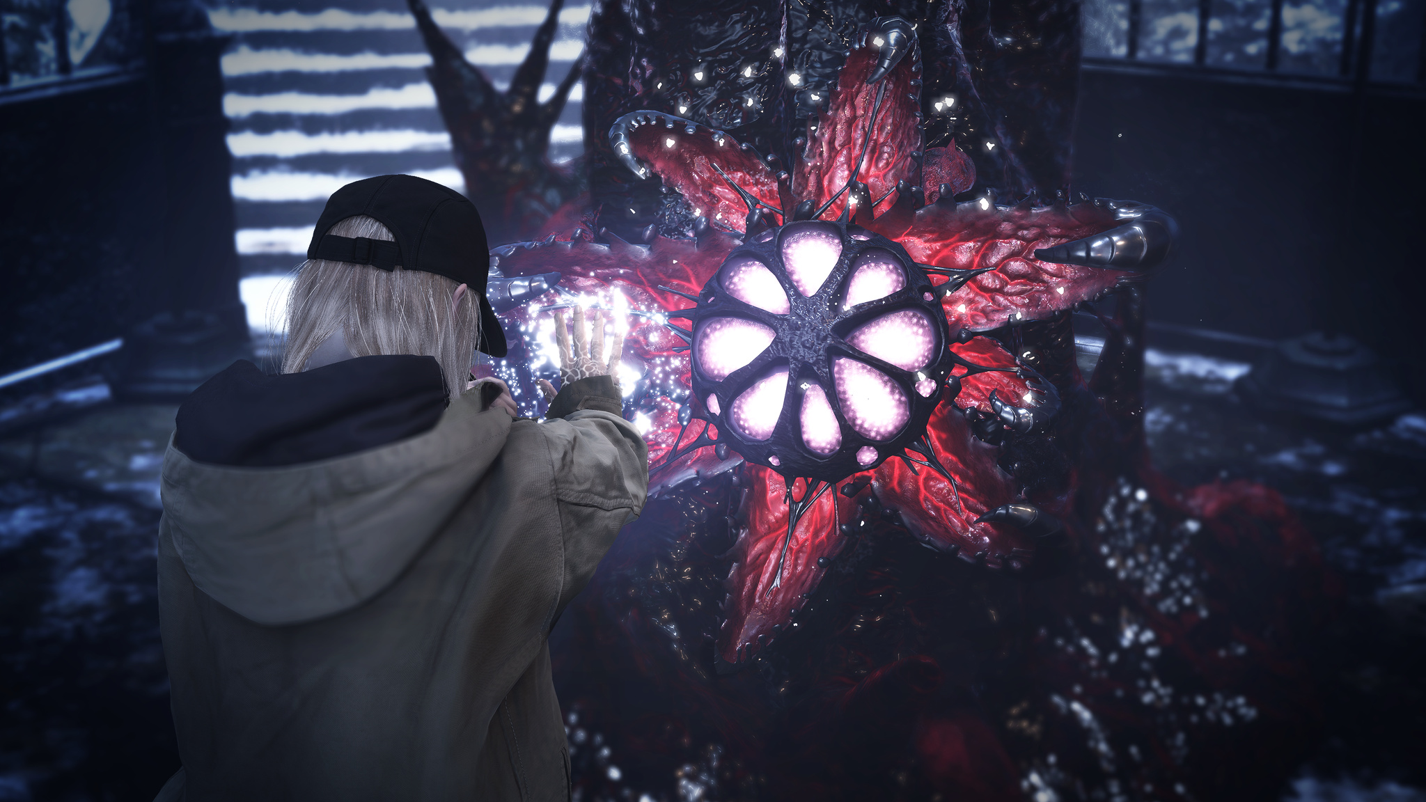 A screenshot from Resident Evil Village, in which a woman in a black hat uses magic against a shrieking monster with an enormous red open mouth.