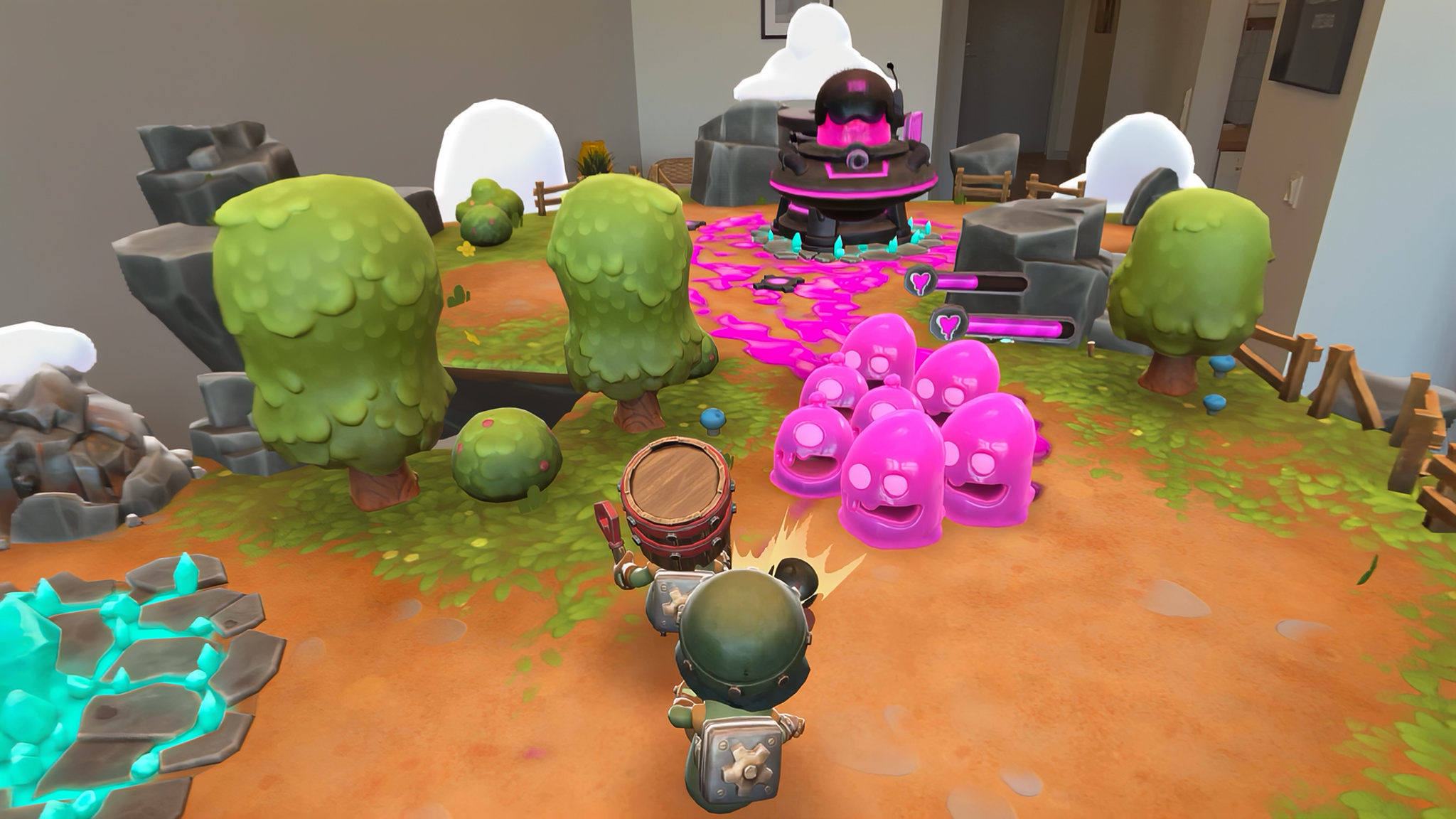 A player character in Gears & Goo — a small, armored figure carrying a barrel on its back — faces a cluster of round, bright pink slime enemies advancing across an orange dirt battlefield. A large dark boss-like structure glowing with pink energy looms in the background, flanked by health bars and teal crystal effects scattered around the terrain.